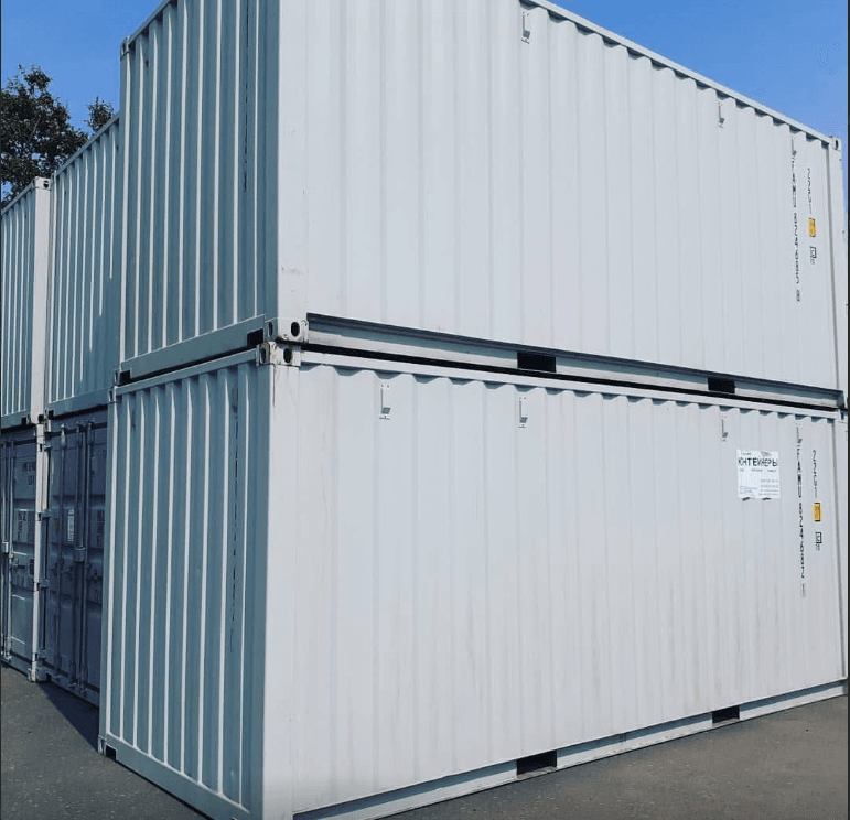Close-up of the top rail and roof edge of stacked shipping containers