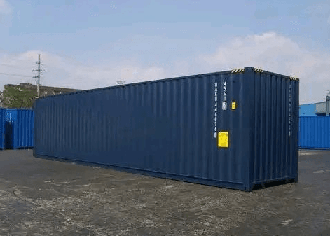 A shipping container freshly repainted in a uniform blue finish