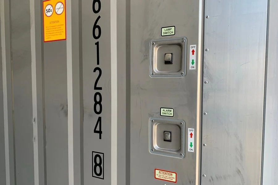 Close-up of a control panel mounted on the end of a container