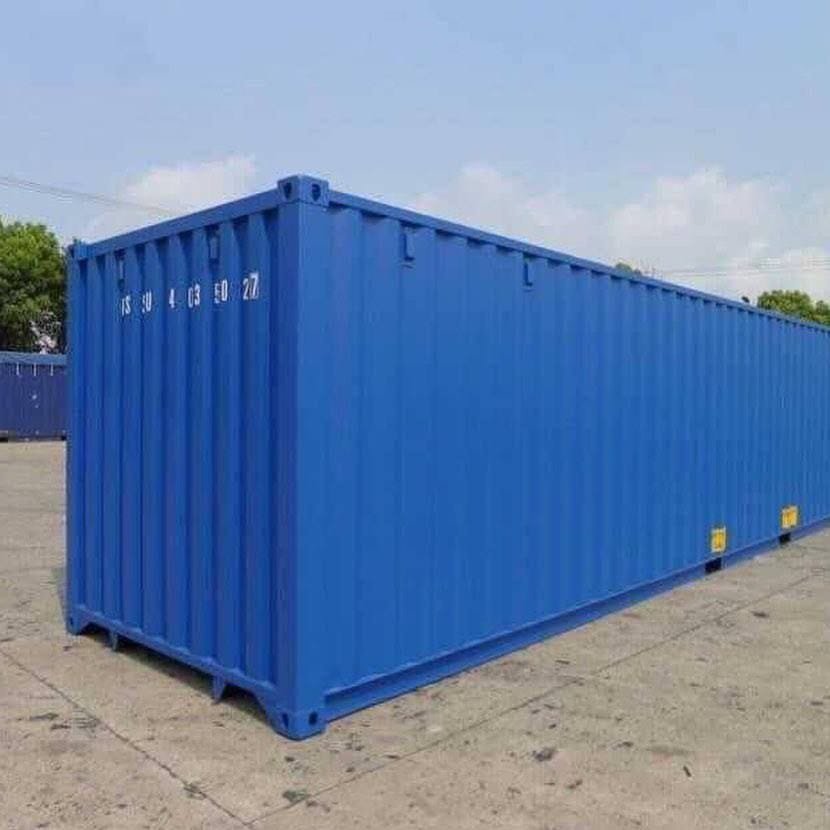 Insulated 40ft shipping container finished in blue standing in a yard