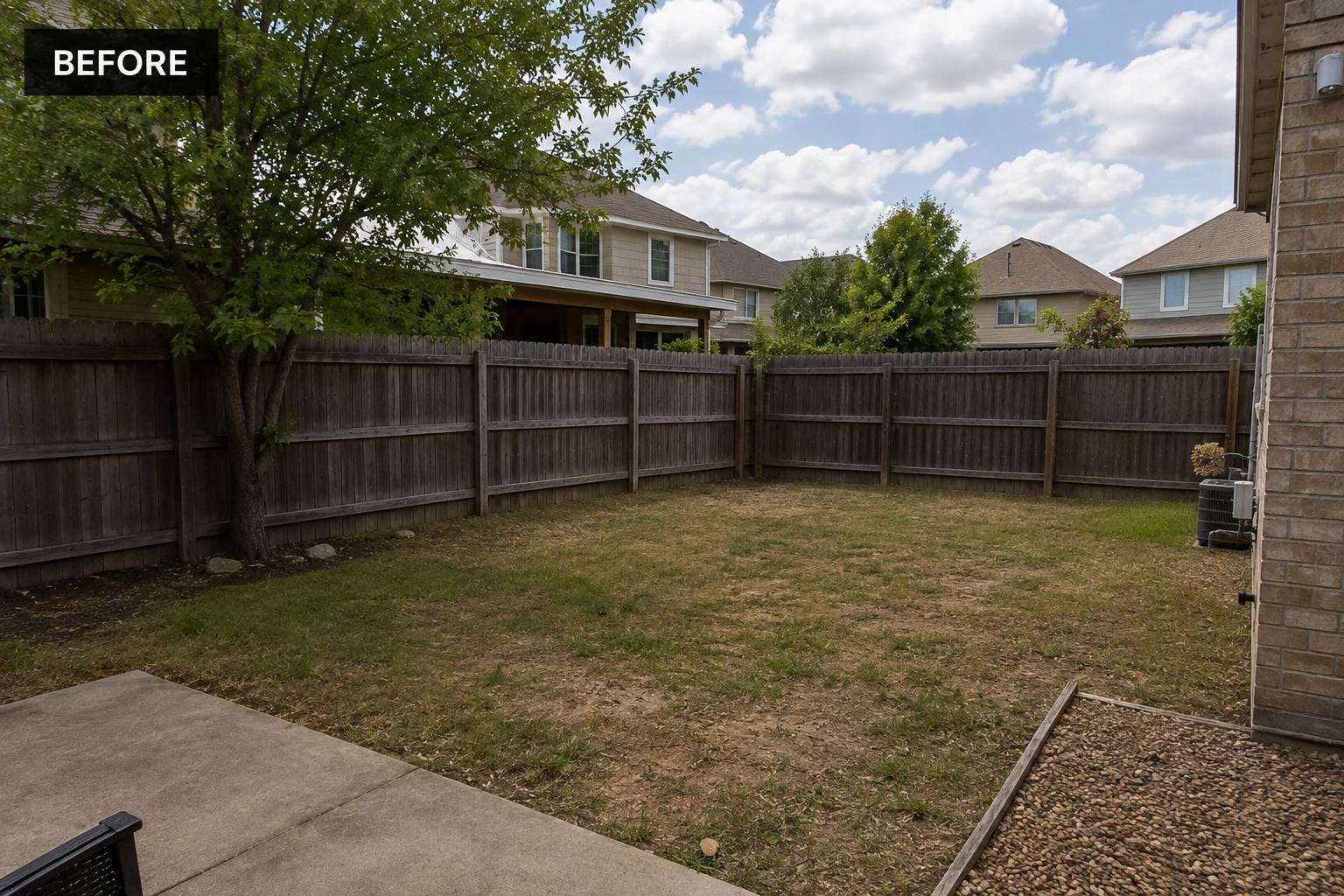 Empty grass backyard in Austin, Texas before the shipping container pool was installed